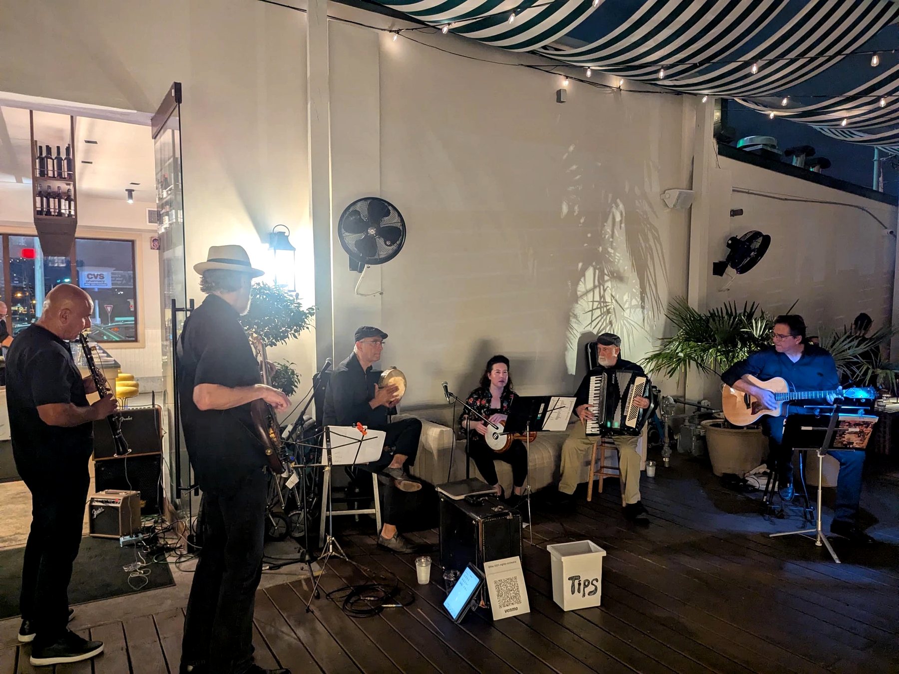 1001 Nights Orchestra performing on the patio at Chocolatería San Ginés, Austin